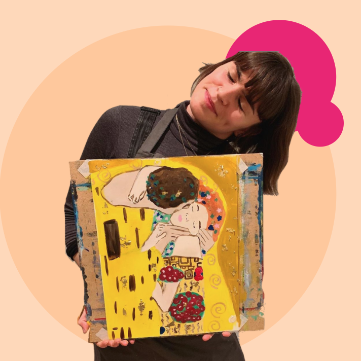 Picture of Gabrielle Corbett, the podcast presenter. She is holding a painting.